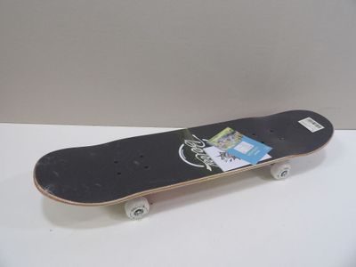 a skateboard with a sticker on it sitting on a table