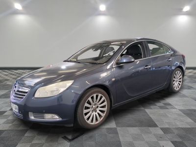 a picture of a blue car parked in a garage