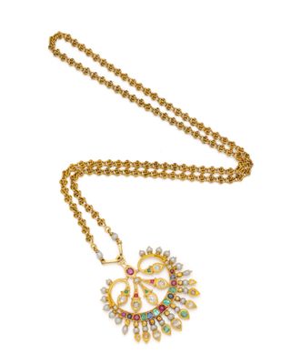 une photo d'un collier en or orné de pierres multicolores