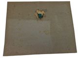 a piece of paper on the floor with a piece of paper sticking out of it