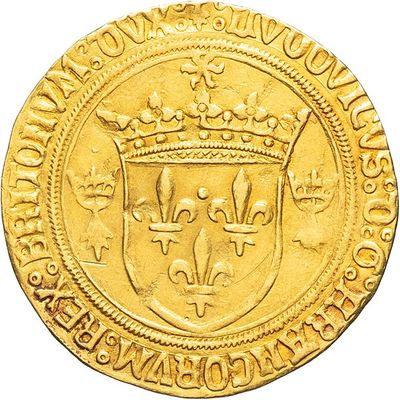 a close up of a gold coin with a crown on it