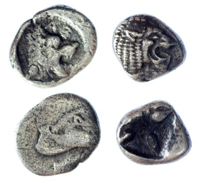 four silver coins with a picture of a man and a woman on them
