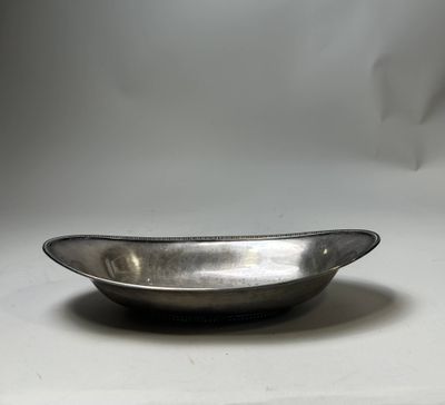 a silver bowl that is sitting on a table
