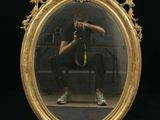 a man taking a picture of himself in a mirror