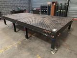 a metal table that is sitting in a garage