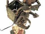 a figurine of a man with a basket on his back