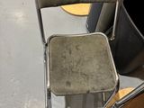 a chair that is sitting in the middle of a room