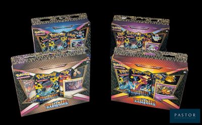 two boxes of pokemon trading cards are shown on a black background