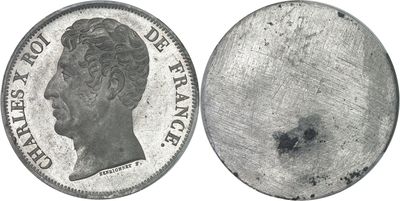an old silver coin with a picture of a man ' s face on it