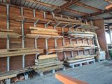 many wooden boards stacked on the shelves in the room