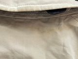 a close up of a jacket with a button on it