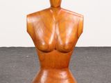 an image of a wooden mannequin sitting on top of a floor