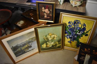 four framed pictures of flowers and a vase on a table