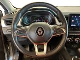 the interior of a car with a steering wheel and dashboard controls