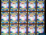 a close up of a bunch of pokemon cards on a table