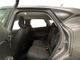 the back seat of a car with the door open and the driver ' s seat down