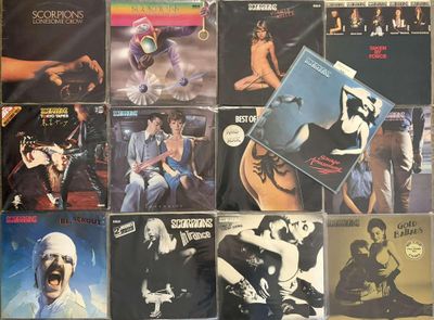 a lot of vinyl records on the table