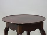 a small table with a wooden top on a white background