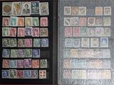 an open book with stamps and stamps in it sitting on a table