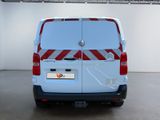 a white van with red and white stripes parked in a garage