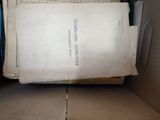 a book in a box with a lot of papers inside of it