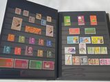 a black book with a lot of stamps on it
