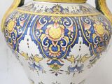a large vase with a handle on a white background