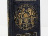 la couverture d'un livre noir orné d'un sceau doré