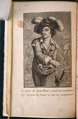 un vieux livre avec l'image d'un homme avec un chapeau