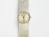 an image of a silver watch with a white face and a silver band