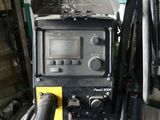 an image of a welding machine in a garage