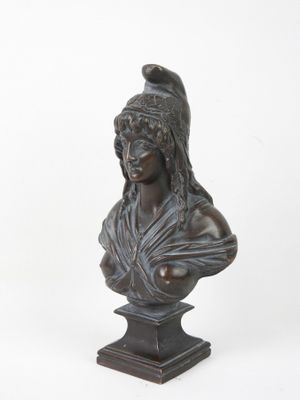 bronze bust of a woman with a helmet on her head