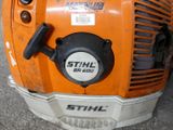 a close up of a stihl blower on the ground