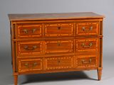 a wooden chest of drawers with many drawers on it