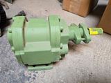 a green machine that is sitting on the floor