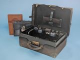 an old suitcase with a bunch of items inside of it