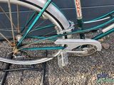 a close up of a bicycle parked on the side of the road