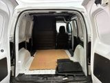 a white van with the door open and a brown mat in the back