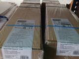 several boxes are stacked on top of each other in a warehouse
