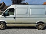 a silver van that is parked in a parking lot