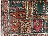 an old rug with many different colors and designs on it