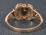 a close up of a ring with a stone in it