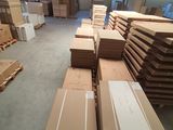 a large room with many boxes and boxes on the floor