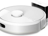 an image of a white robotic vacuum cleaner with a charger