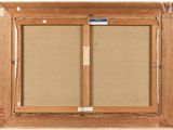 an old picture frame with a picture of a couple of doors