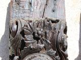 two pieces of wood with carvings on them on the ground