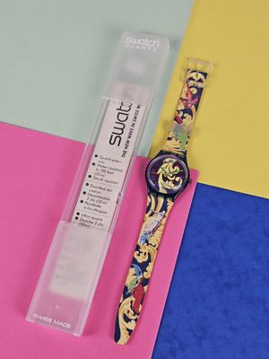 a watch that is sitting on top of a piece of paper
