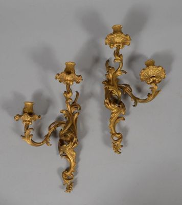 pair of antique brass wall sconces in the style of person