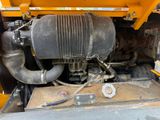 a close up view of the engine of a construction vehicle