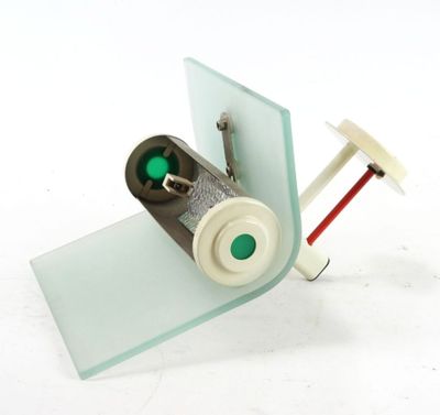 a small model of a plane with a green light on it